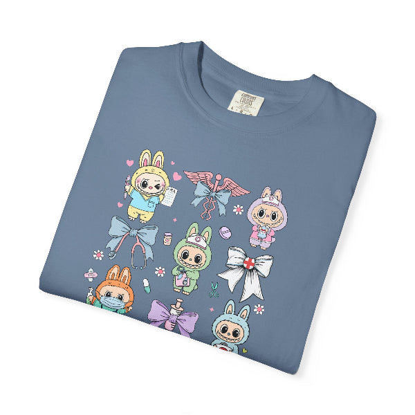 Folded blue t-shirt with cartoon characters and bows on a white background