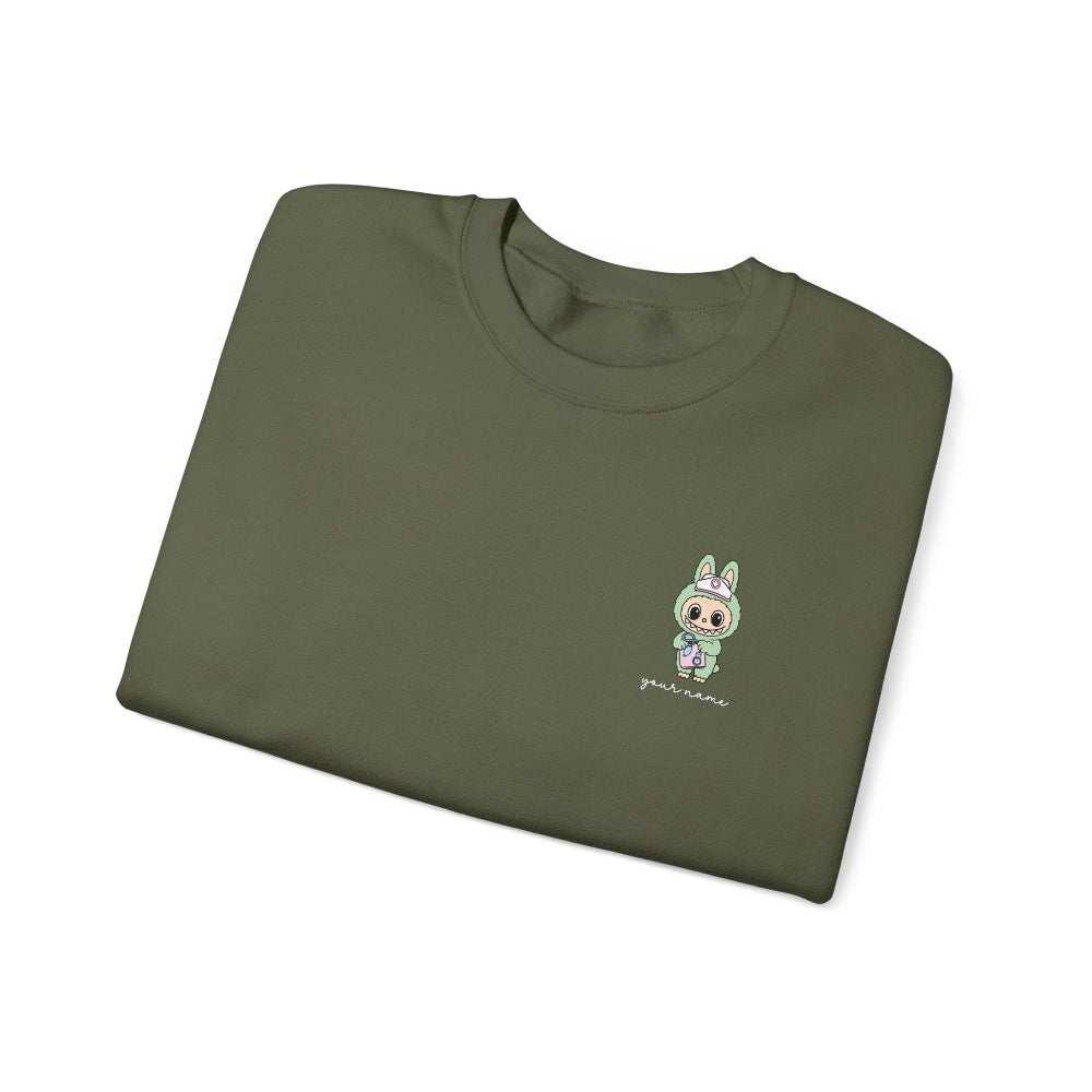 Folded green t-shirt with a small embroidered design on a white background