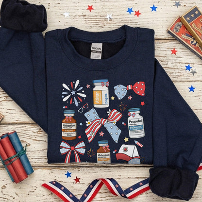 Navy blue sweatshirt with patriotic design on a wooden surface with decorative items.