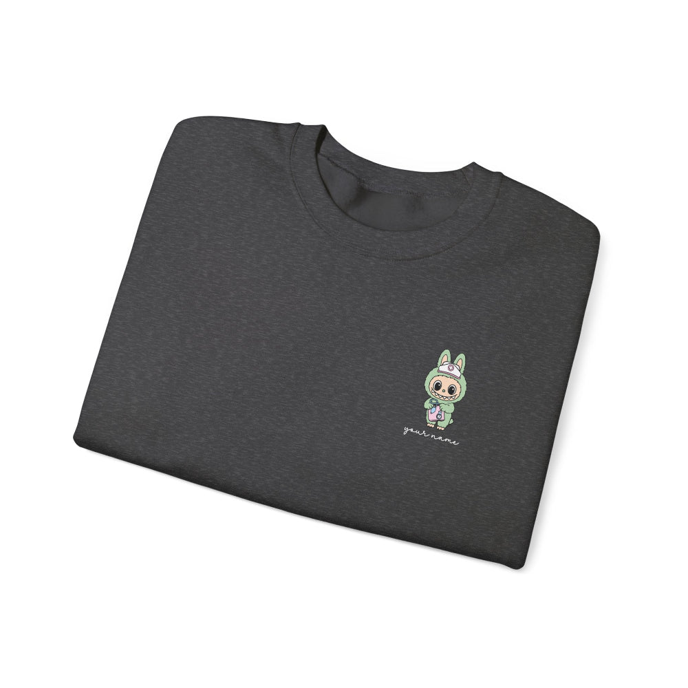 Folded dark gray t-shirt with a small embroidered design on a white background